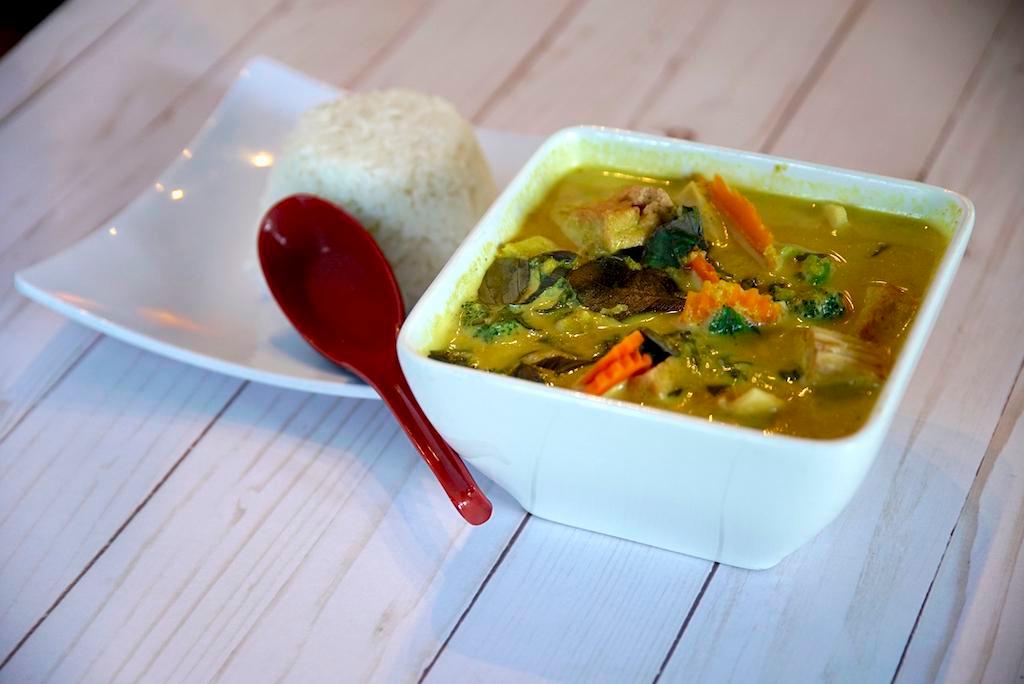Yellow Coconut Curry · Yellow coconut curry with sweet potatoes, carrots, broccoli, bamboo shoots, served steamed rice.