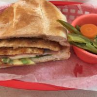 Breaded Chicken Torta · Breaded chicken. Served with mayo, lettuce, tomato, avocado and refried beans 