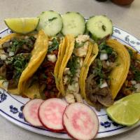Carne Asada (Steak Tacos with Grilled Onions) (5) · 5 corn tortillas with grilled steak and onions, served with onions, cilantro and a side of c...