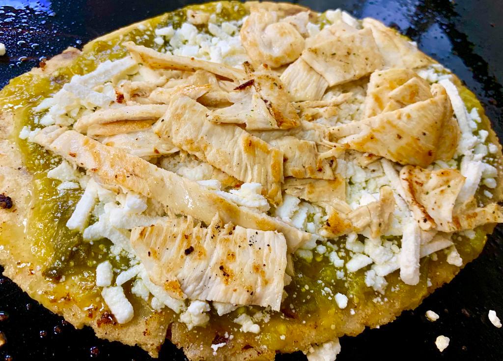 Grilled Chicken Huarache · Served with green, red, or campechano sauce, onions, and queso fresco.