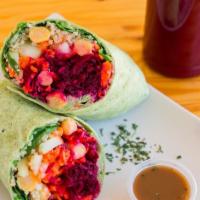 Veggie Wrap · Hummus, cucumber, quinoa, chickpeas, carrot and beet layered in a spinach wrap with balsamic...