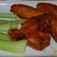 Buffalo Wings · 12 meaty Buffalo-style wings in our Buffalo sauce. Served with celery sticks and bleu cheese.