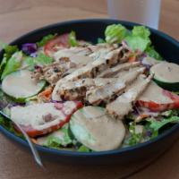 Grilled Chicken Salad · A lean and healthy choice of crisp greens, garnished with vegetables and completed with an 8...