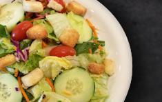 Garden Salad · Fresh NEW Round Table salad blend with grape tomatoes, cucumbers, croutons and your choice o...