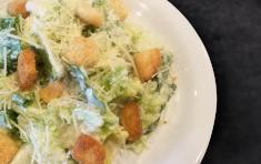 Caesar Salad · Crisp Romaine lettuce, shredded Parmesan cheese, garlic Parmesan croutons and our classic Ca...