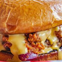 Chili Cheddar Burger · Our hand-spanked patties topped with cheddar cheese and our famous chili.