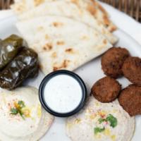 Maza Plate  · Vegan, gluten-free. Hummus, babaganoush, grape leaves, falafel and dipping sauce. Served wit...