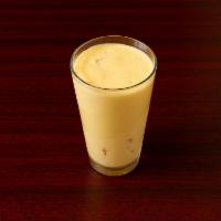 Mango Lassi · Natural yogurt mixed with mango and milk, a healthy and refreshing treat.