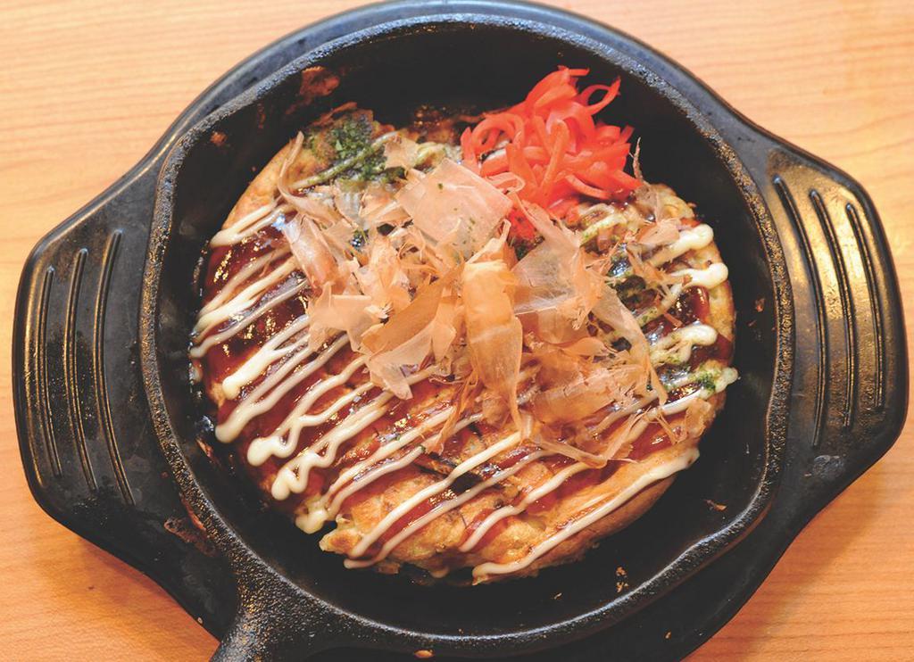 Okonomiyaki · Japanese savory pancake with cabbage, bean sprouts, red ginger, dried bonito and pork.