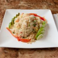 T14. Thai Pineapple Coconut Fried Rice · Coconut fried rice with chicken topped with ground peanuts.