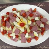 Country Pasta Salad · Pasta, diced ham, tomatoes, hard-boiled eggs, and mayonnaise.