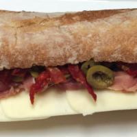 2. Italian Sandwich · Prosciutto ham, mozzarella cheese, dried tomatoes, olives, olive oil, and Italian seasoning.