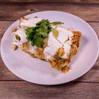 Enchiladas Suizas Plate · 3 shredded chicken enchiladas covered with a creamy tomatillo sauce. Topped with melted chee...