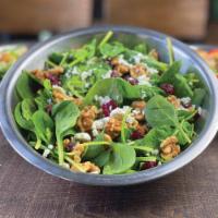 Walnut Cranberry · Fresh spinach tossed in our raspberry cane dressing topped with halved walnuts (tree nuts), ...