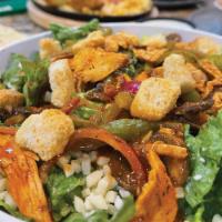 Kickin' Chicken Salad · Green peppers, red onions, mushrooms, & chicken, sautéed in spicy wing sauce on romaine lett...