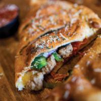 Meat Feast Calzone  · Pepperoni, Italian sausage, & Canadian bacon.