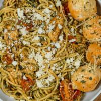 Pesto Manifesto · Spaghetti, bruschetta, sautéed chicken, parmesan cheese, & pesto (tree nuts), topped with fe...