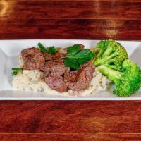 Marinated Steak Tips Plate · Grilled to perfection, with creamy mashed potato, sauteed spinach, garlic herb butter, and a...