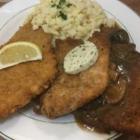 Eins Zwei Drei Schnitzel · Pork cutlet with jaeger gravy; veal cutlet with lemon wedge; chicken cutlet with black truff...