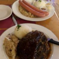 Schweinebraten · A hefty portion of oven roasted pork with a crackling skin served with a spaten beer gravy, ...