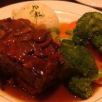 Hackbraten · Jager or zigeuner style meatloaf served with mashed potatoes and vegetables.