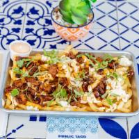 Public Fries · French fries topped with the street taco meat of your choice, topped with Cotija cheese, sli...