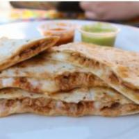 Machaca Quesadilla · Grilled flour tortilla filled with mozzarella cheese and shredded beef. Served with chipotle...