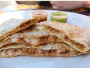Machaca Quesadilla · Grilled flour tortilla filled with mozzarella cheese and shredded beef. Served with chipotle and avocado salsas.