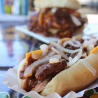 Chili Cheese Dog · 100% beef dog served on a grilled bun with mustard, onion, cheese and Yuca's all meat chili.