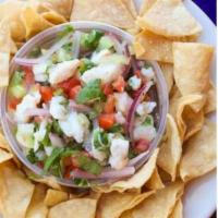 Ceviche · White fish marinated in citrus juices with tomato, red onion, cilantro, cucumber, and finely...