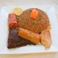 Chep With Fish ( Jollof rice with fish)  · Red jollof rice with fish and vegetables carrot, cabbage and cassava.