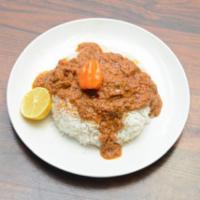 Mafeh · peanut butter cooked with lamb blended vegetables, serve over Jasmine white rice 