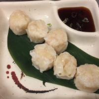 D6. Shumai · 6 pieces. Steamed shrimp dumpling.