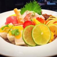 E11. Chirashi · 15 pieces sashimi and vegetable over sushi rice.