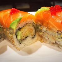R31. Cool Summer Roll · Tempura shrimp, cucumber inside, topped with fresh salmon, avocado and special sauce. Raw.