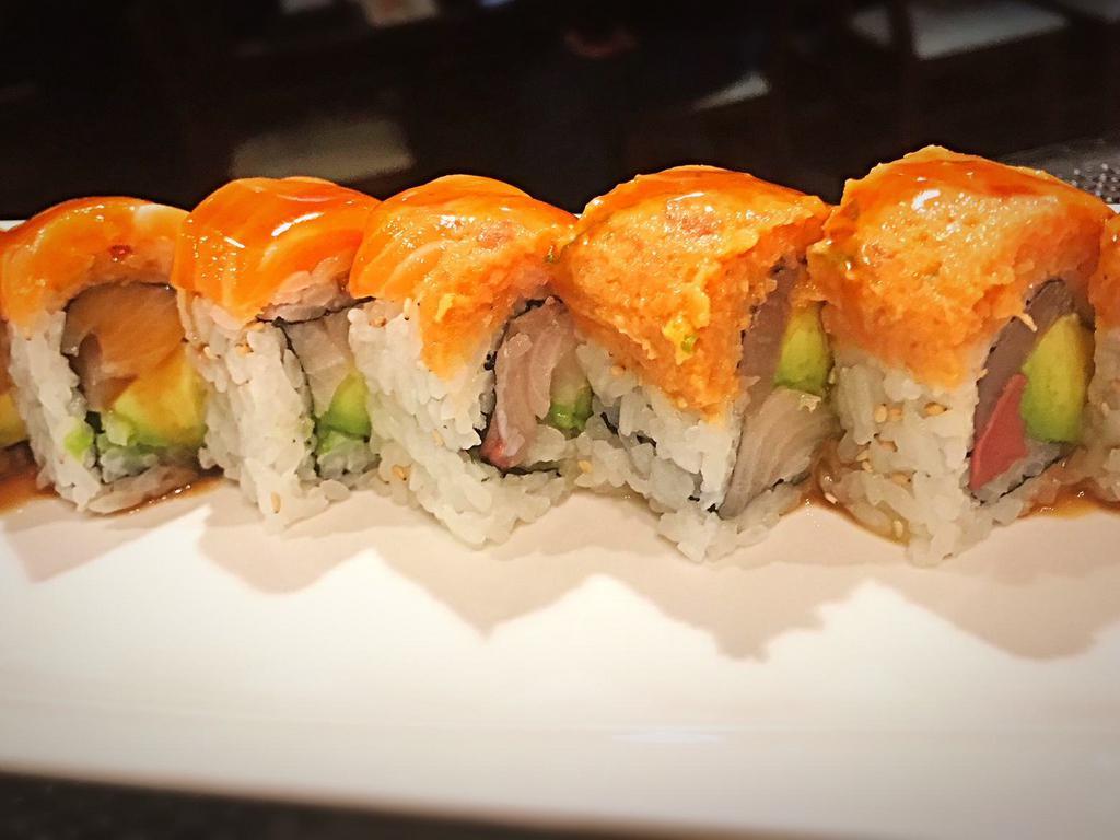 R32. Monster Roll · Yellowtail, avocado inside, topped with fresh salmon, spicy tuna and special sauce. Spicy. Raw.