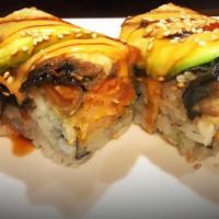 R41. Romance Roll · Spicy tuna, super white tuna inside, topped with eel, avocado and special sauce. Spicy. Raw.