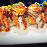 R42. Chaos Roll · Spicy tuna, mango inside, topped with tempura white fish and special sauce. Spicy. Raw.