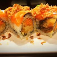 R47. Pink Lady Roll · Tempura shrimp and spicy kani inside, topped with eel, salmon, avocado and fried onion. Spic...