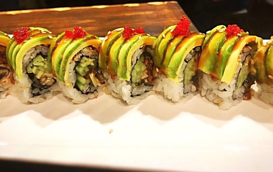 R51. Green Dragon Roll · Eel, cucumber inside, topped with avocado and eel sauce. Cooked.