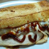 Chicken Barbecue Sandwich · Barbecue sauce, sliced chicken breast, onions, and mozzarella. With French roll.