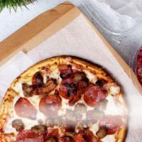 Carnivore Pizza · Marinara. Ham, pepperoni, sausage, bacon, mozzarella and sriracha.