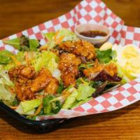 Sesame Ginger Chicken Salad · mixed greens, carrots, diced onions, sliced eggs, shredded cheese, tossed in sweet sesame gi...