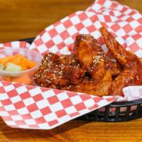 Spicy Garlic Crispy Wings · served with side of french fries