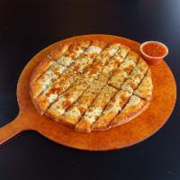 Cheesy Breadsticks · Homemade dough topped with butter, cheese & seasoning.