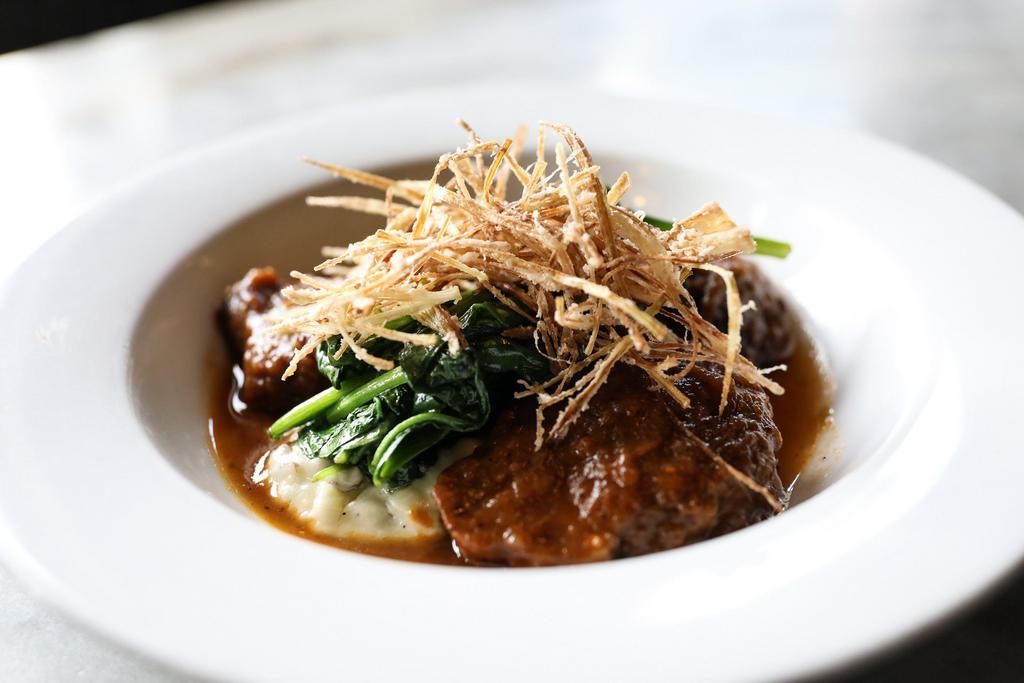 Braised Shortribs Plate · Smashed redskin potatoes, sauteed spinach leeks, and jus reduction.