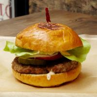 1/3 lb. The Classic Burger · Organic beef burger. Served with onions, tomatoes, lettuce, pickles and our house made lemon...