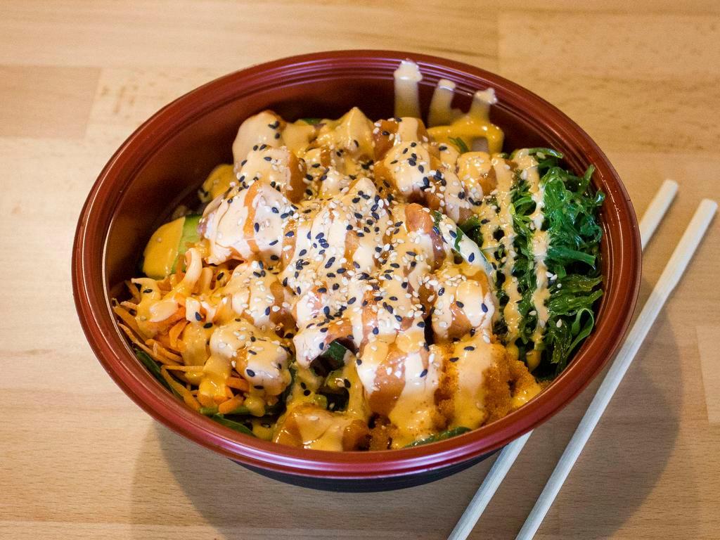 3. Volcano Bowl · Spicy salmon, spicy tuna, spinach, red onion, jalapeno, cucumber, carrot, seaweed salad, masago, Sriracha mayo sauce and sesame seed topping.