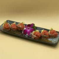 Scott Albacore Roll · 6 pieces. Spicy tuna, avocado wrapped in albacore topped with mustard and spicy sauce.