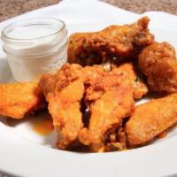 Buffalo Wings · Dipped in a medium hot sauce and served with bleu cheese